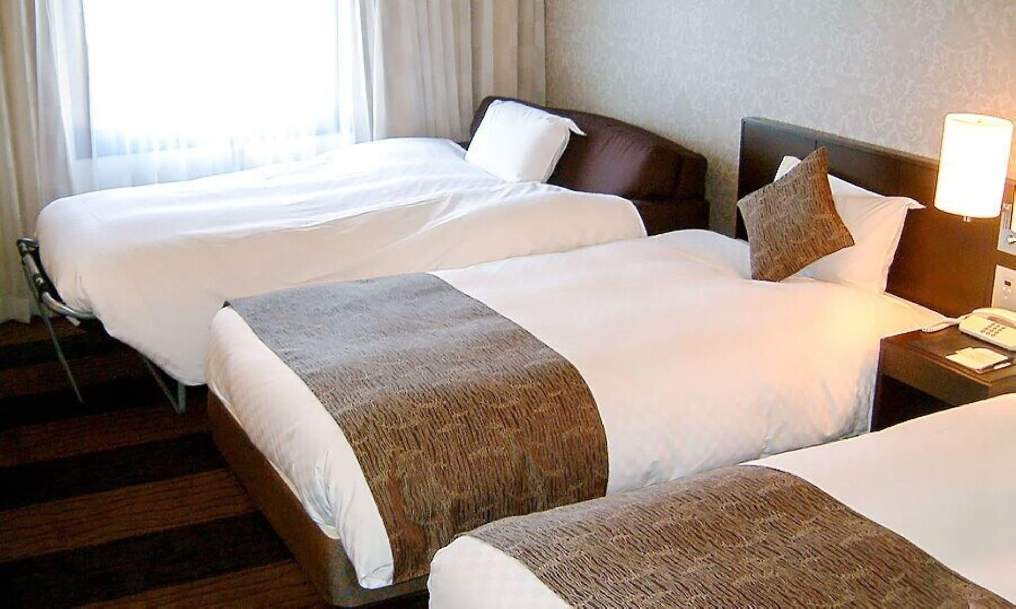 Hotel Granvia Wakayama Eksteriør billede Beds with bed runners